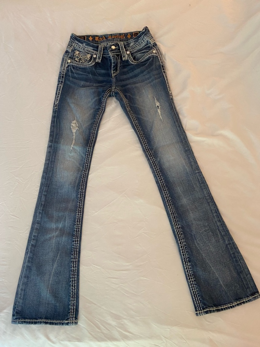 Rock Revival Distressed Jeans Size 25 – Heavy Stitching & Embellished Pockets
